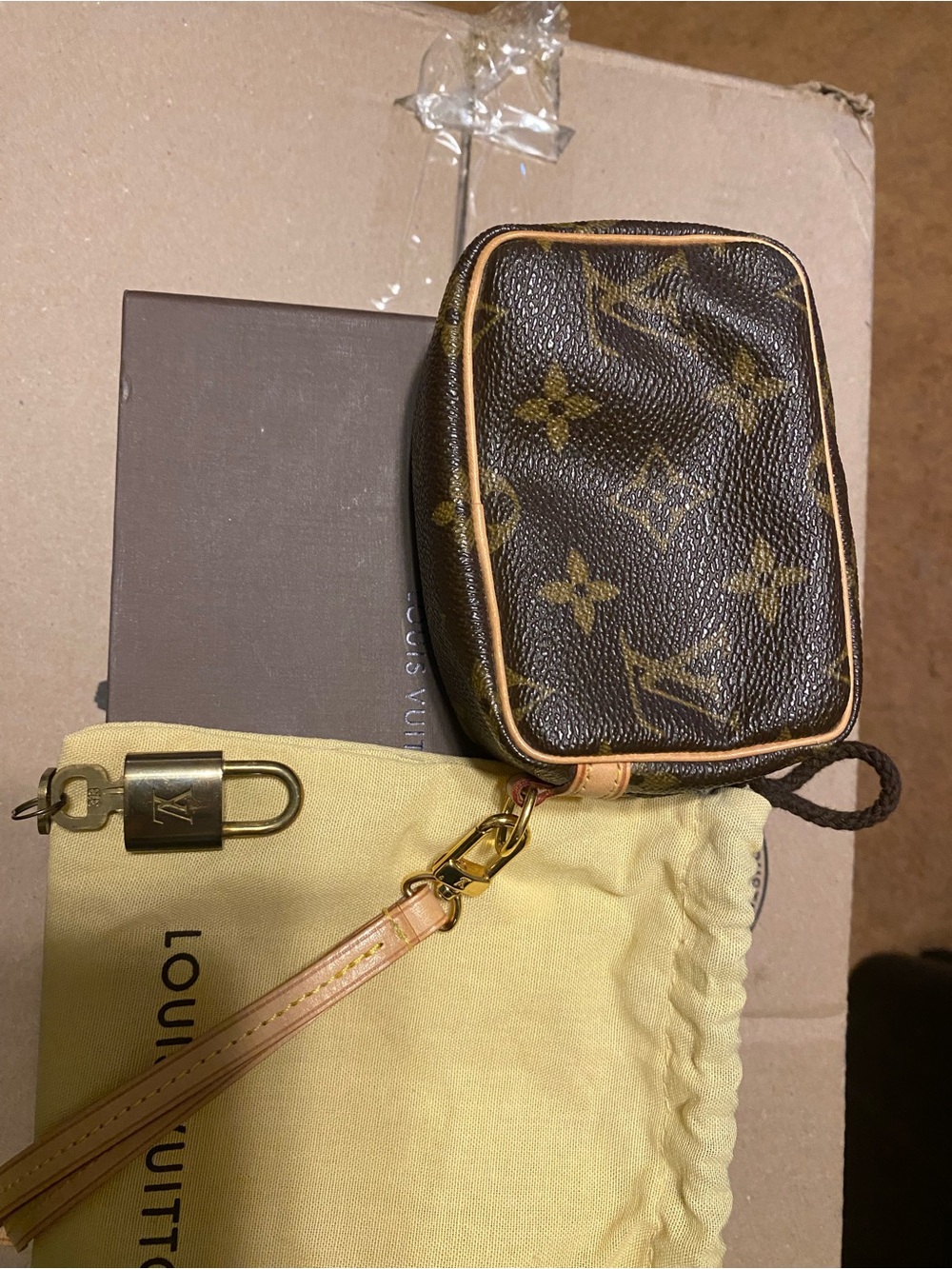 Louis Vuitton Monogram Mini Pouch in Brown with Tan Trim plus padlock